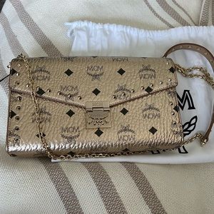 NWT- Gold MCM crossbody-unique- studs on flap and shoulder strap.